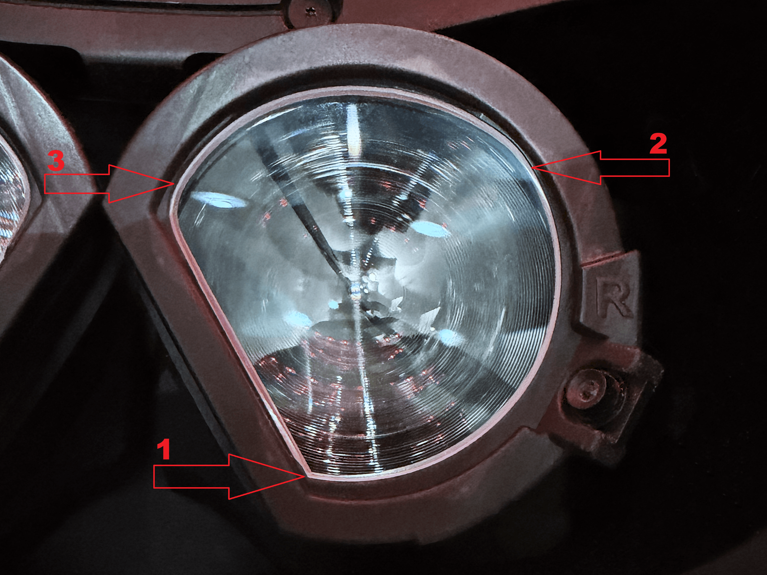 Right lens (R) in the new eye module, with red arrows showing the press order: 1 = lower (sharper) corner, 2 = upper outer edge, 3 = upper inner edge