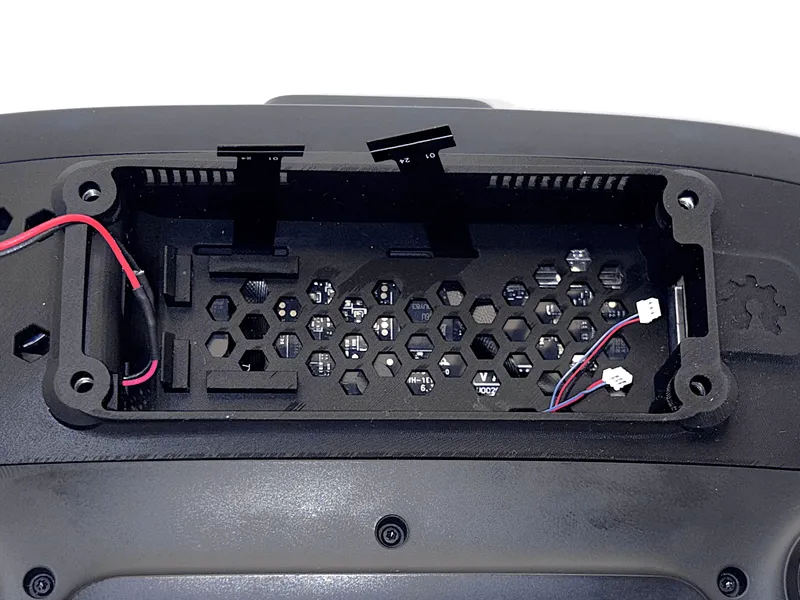 Gold contacts of ribbon cables facing upward in the passthrough